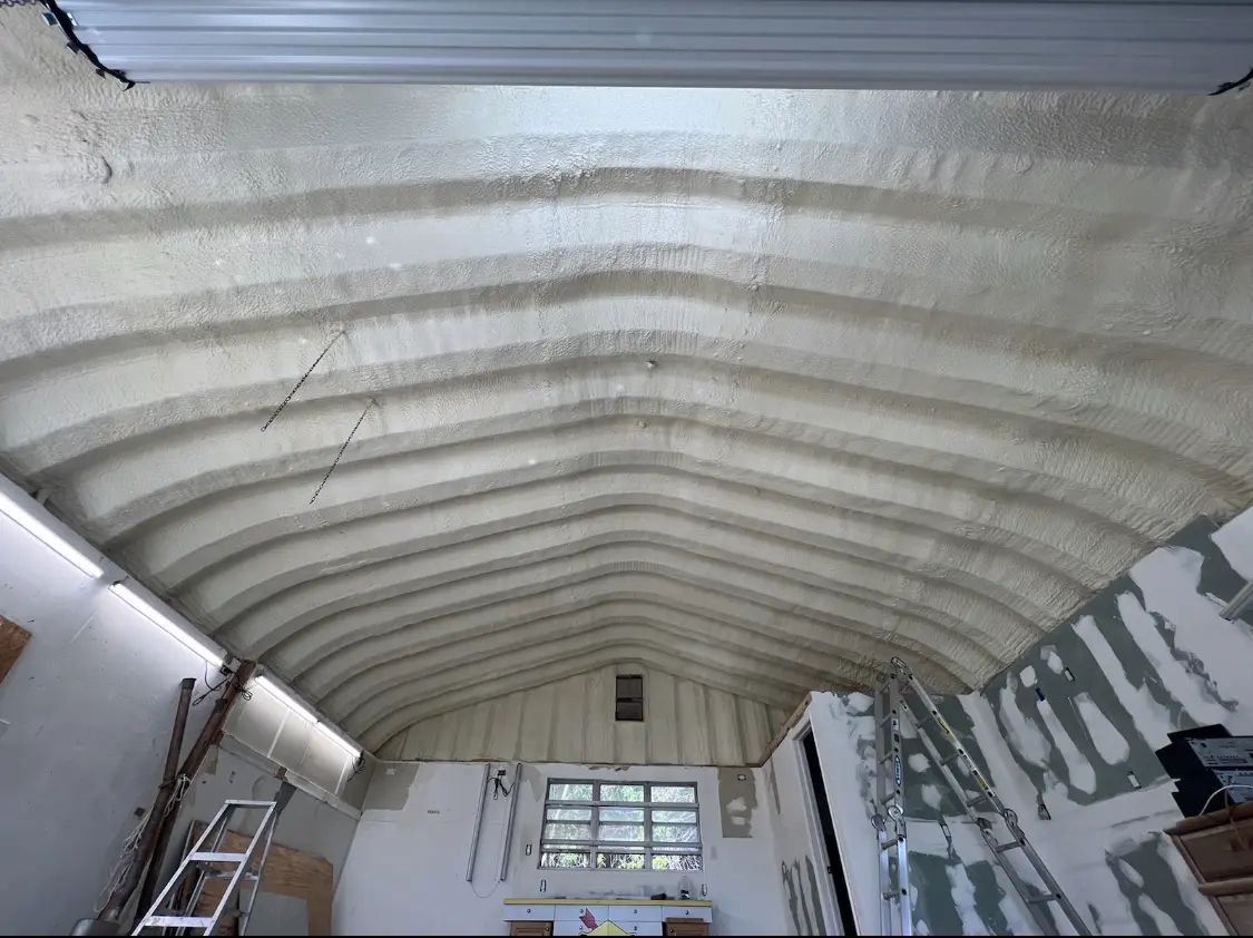 Spray polyurethane foam applied to the underside of a metal roof deck in La Joya